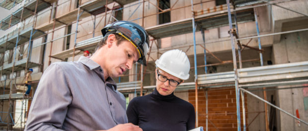 Discussing at construction site