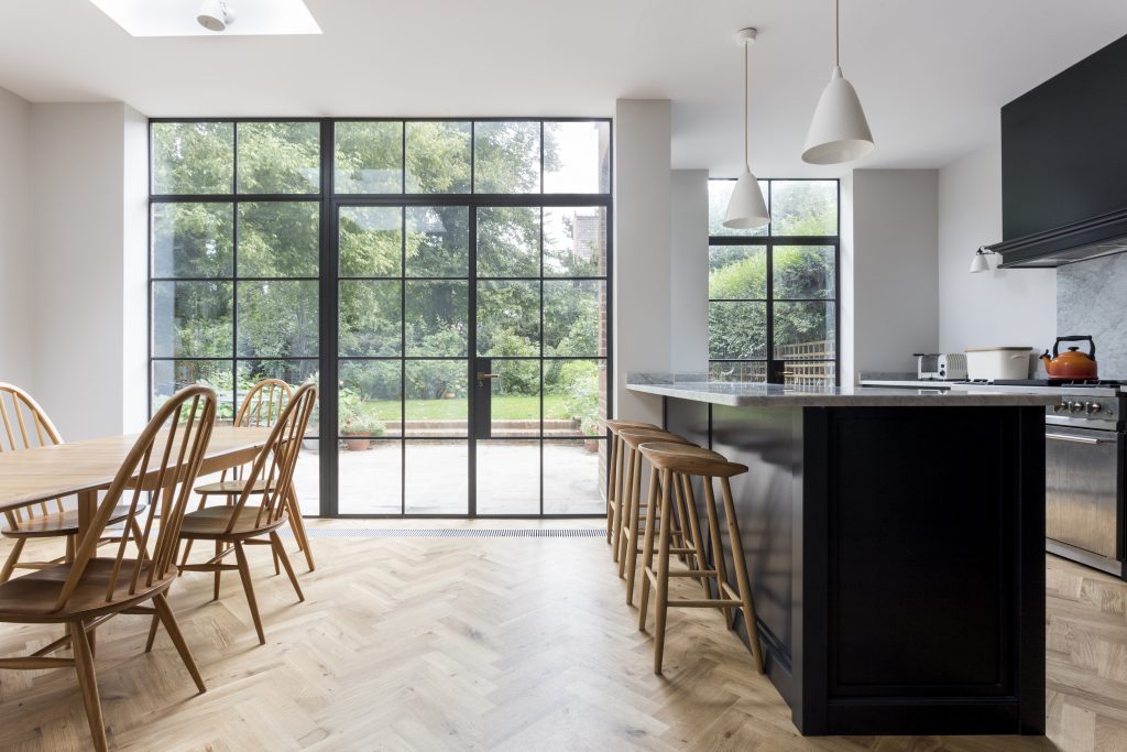 TR Studio extend Arts & Crafts family home with single-story brick and ...