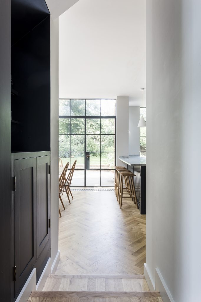 TR Studio extend Arts & Crafts family home with single-story brick and ...