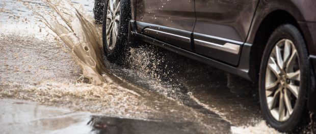 Dirty,Water,Splash,After,Vehicle,Roaring,By